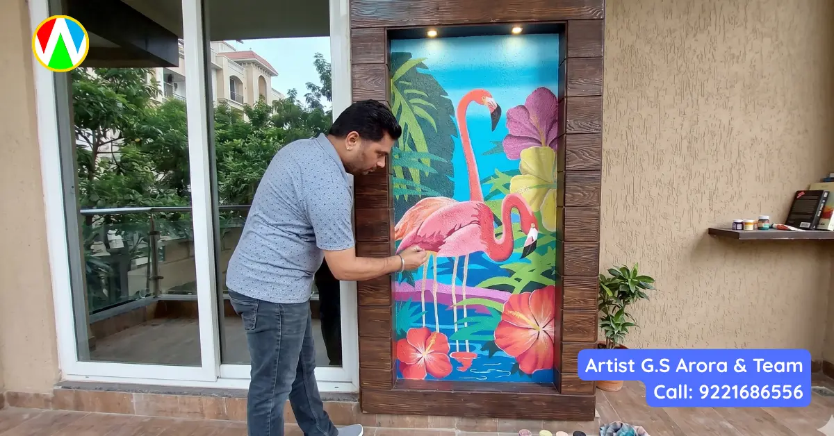 Artist G.S. Arora painting a vibrant tropical flamingo mural with a palette cart on a luxury balcony