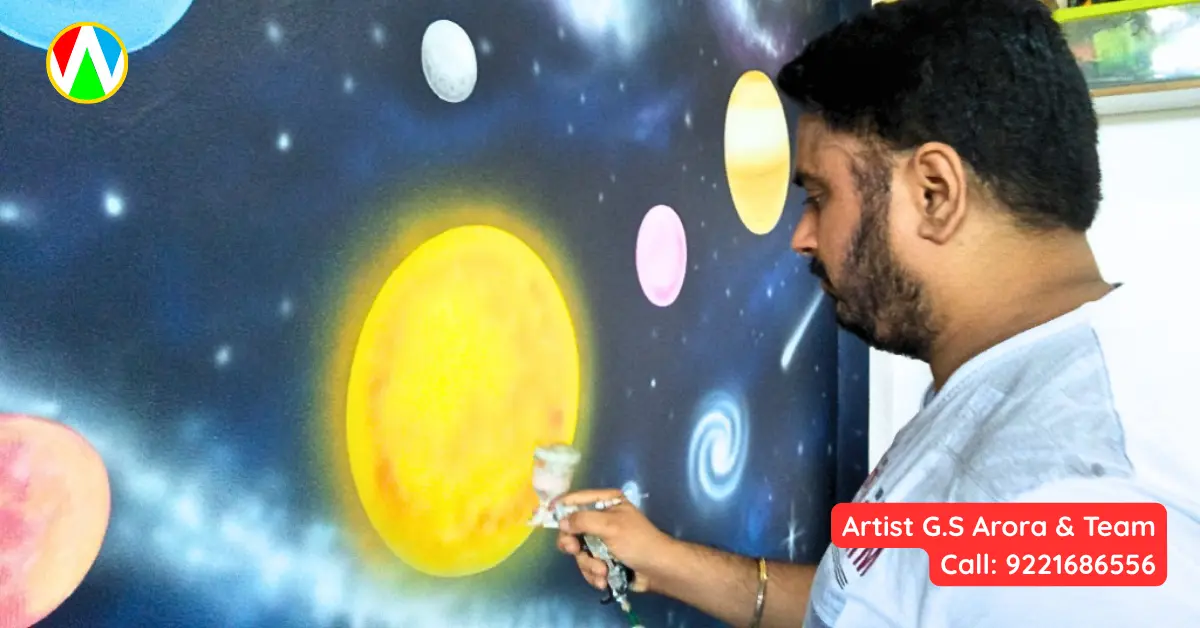 Artist G.S. Arora painting glowing sun in space mural