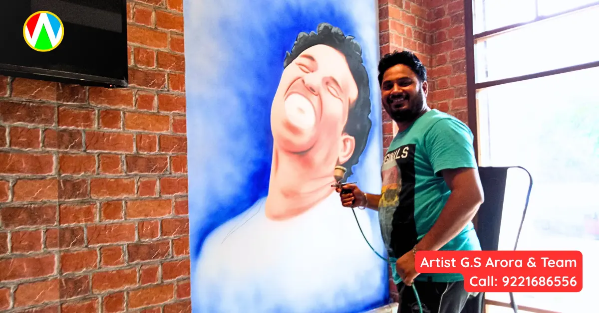 Artist G.S. Arora creating a stunning Sachin Tendulkar wall painting using airbrush
